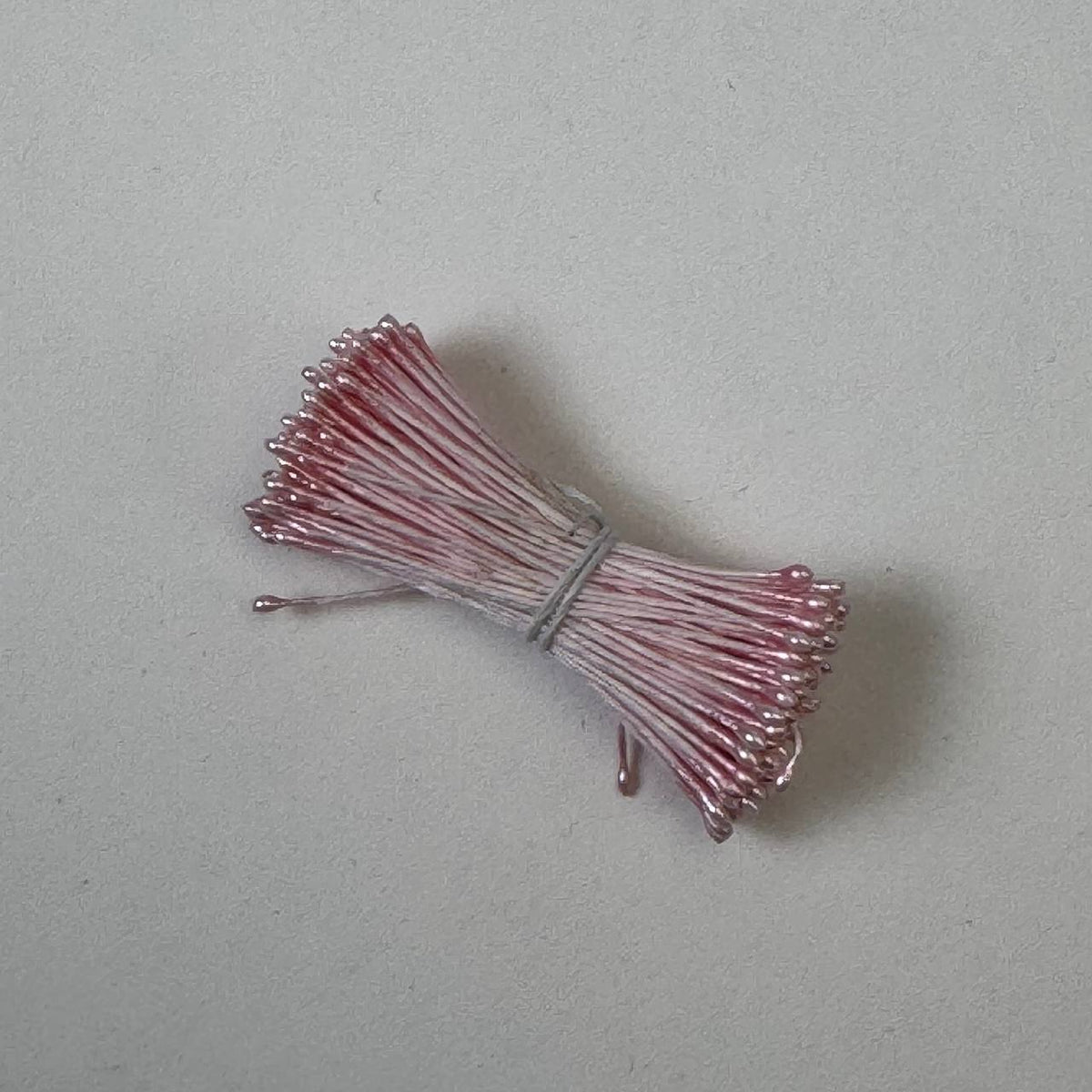 Pink pearly round ball flower stamens size M with glossy luster on matching pink cotton threads, premium Japanese craft supplies